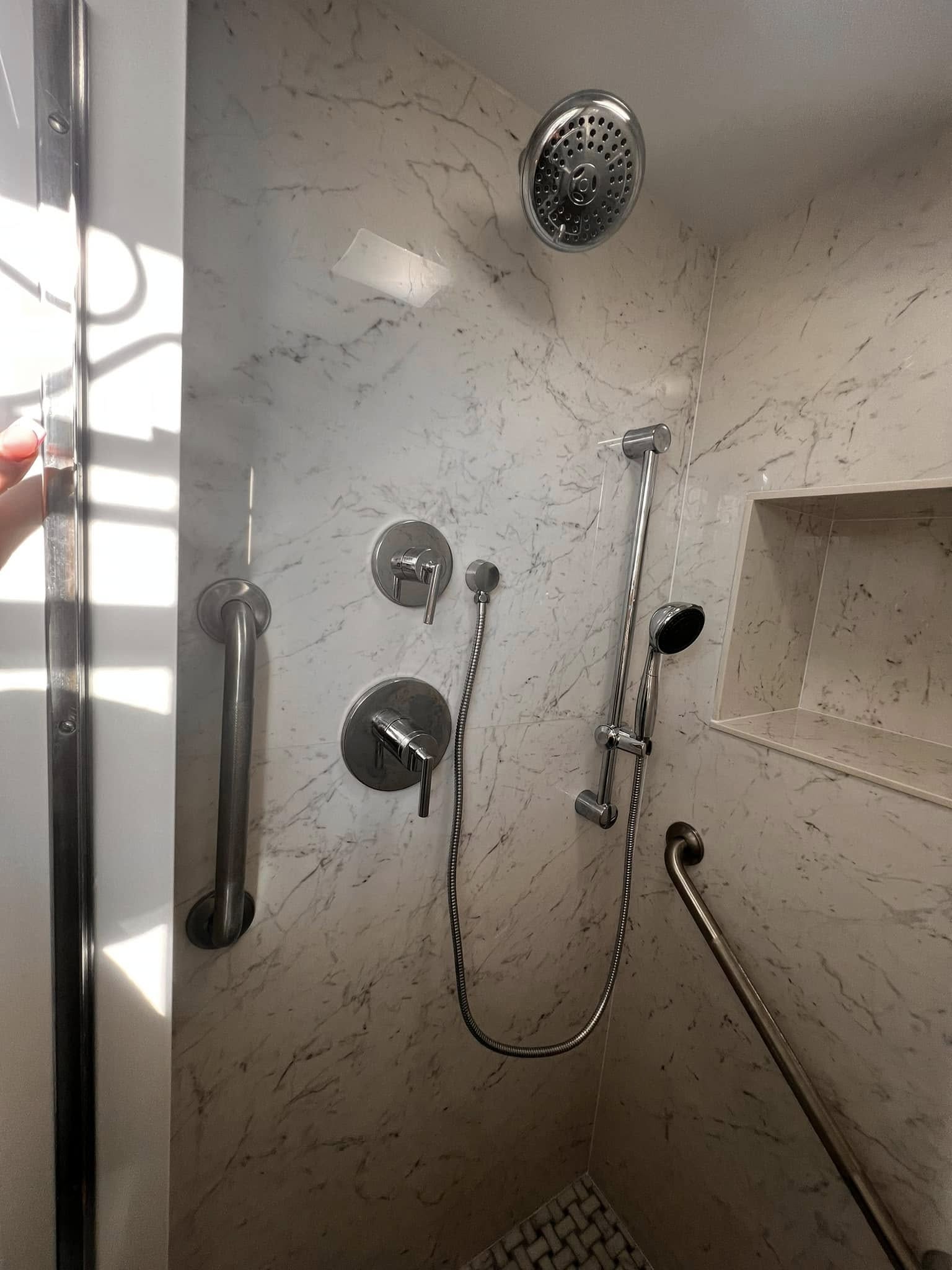 Accessible walk-in shower by Delaluz Construction