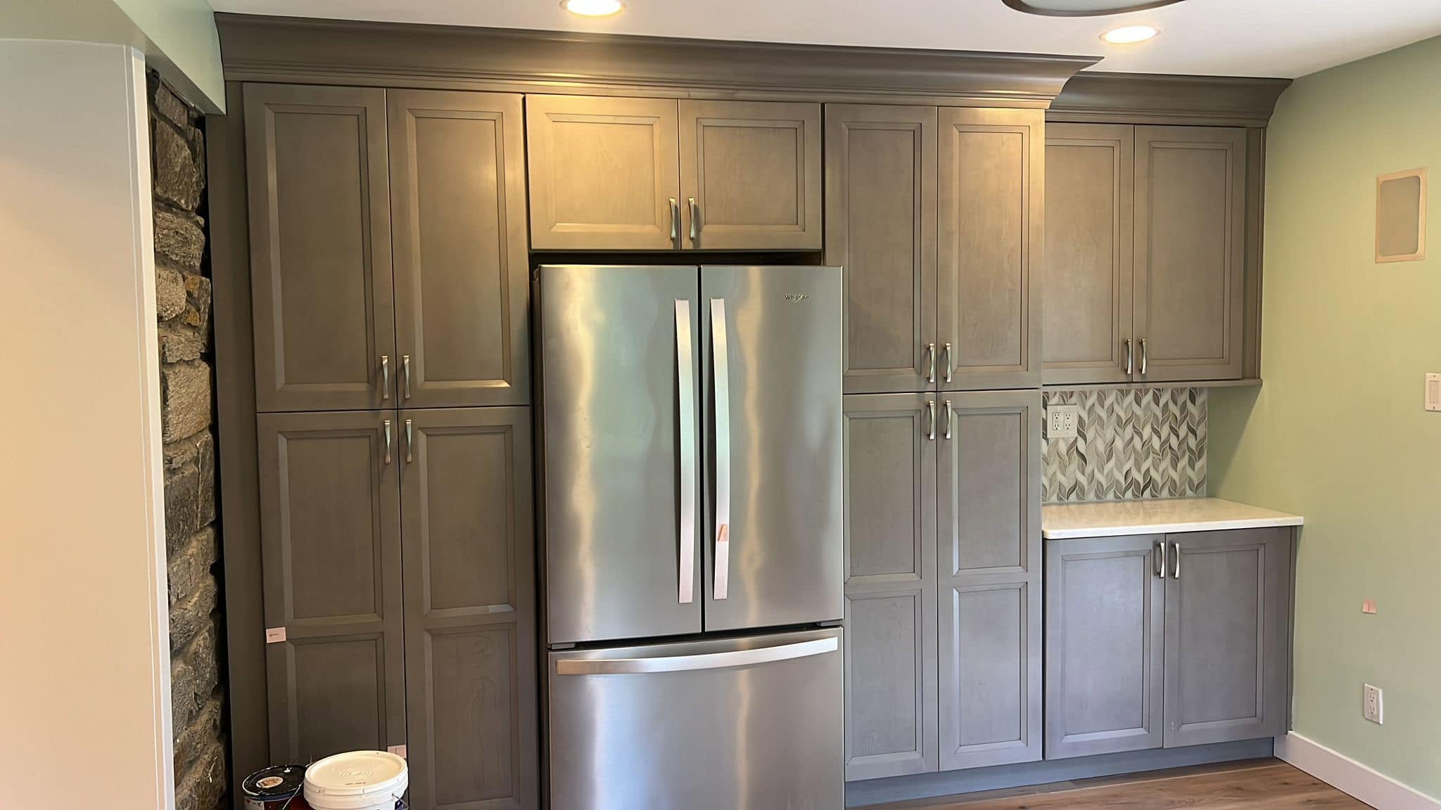 Custom kitchen storage wall by Delaluz Construction