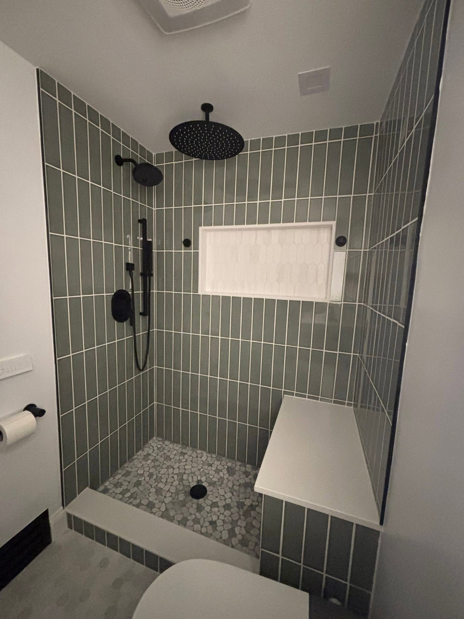 Finished tile shower project by Delaluz Construction
